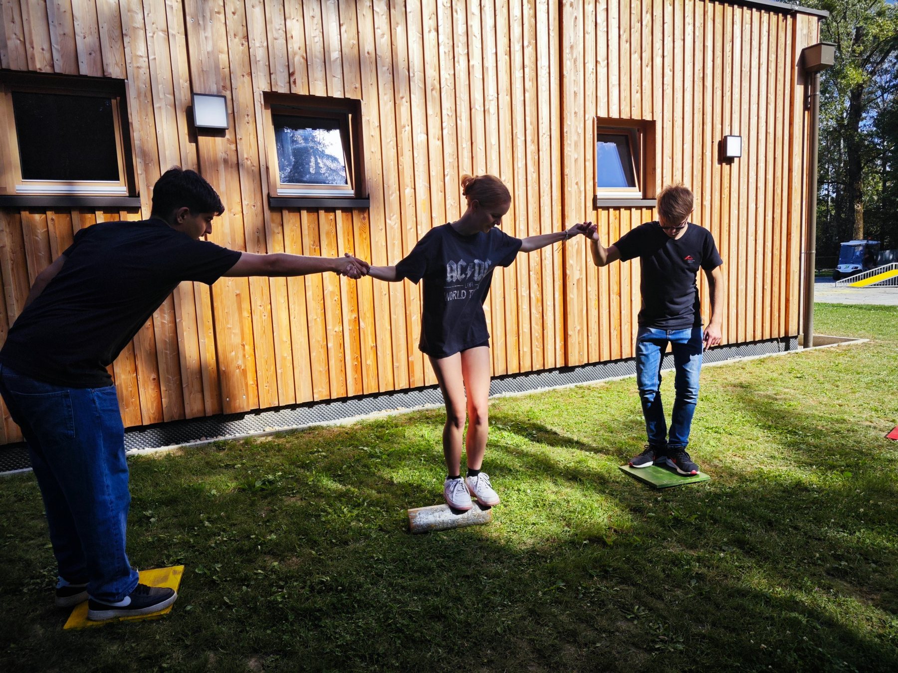 A group reflecting on collaboration through an outdoor exercise