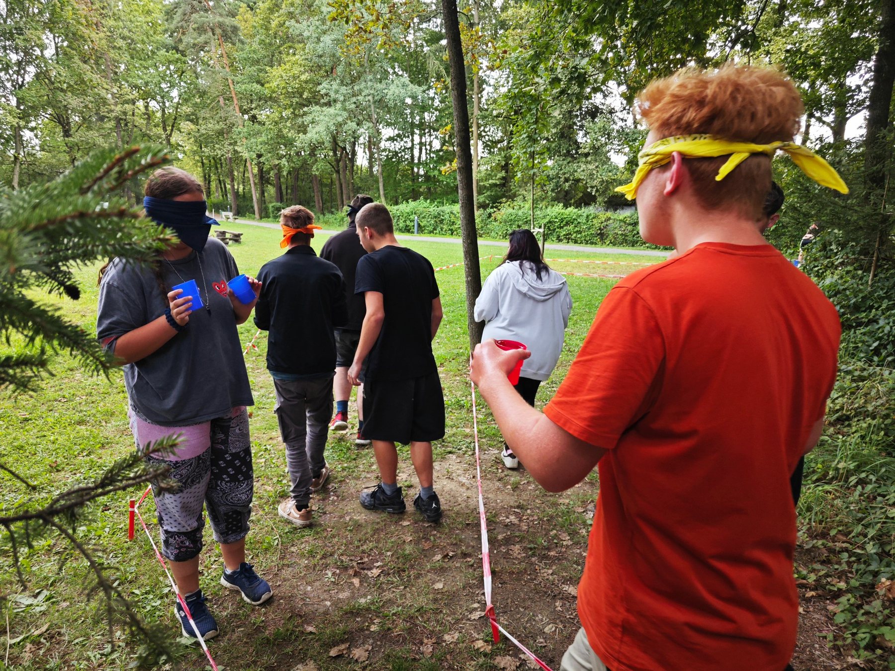 A team working together on an outdoor orientation task