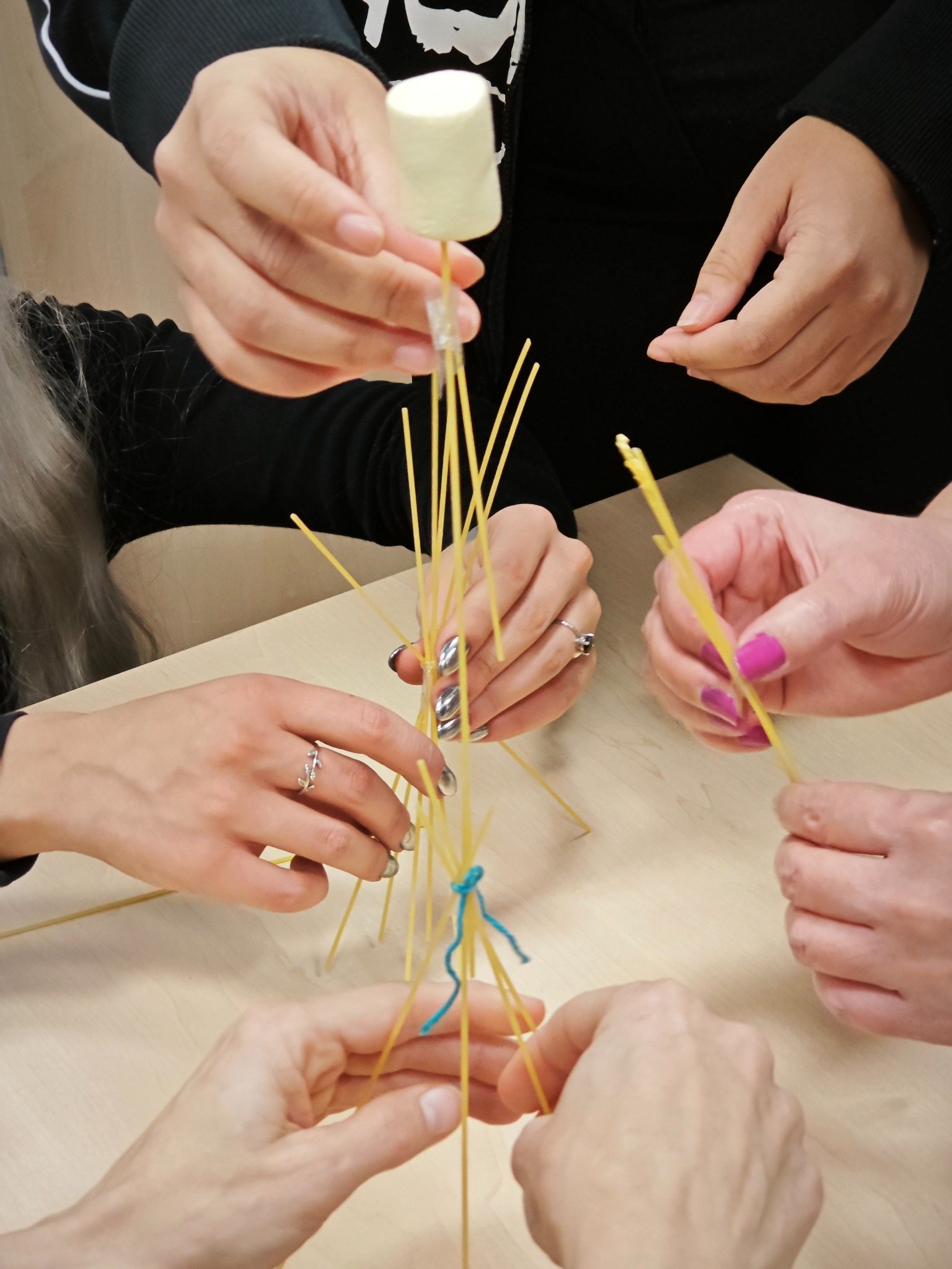 Hands working together on a cooperative construction task